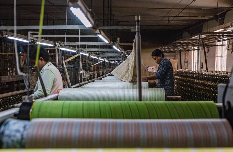 Textile mill weaving looms producing suiting fabric