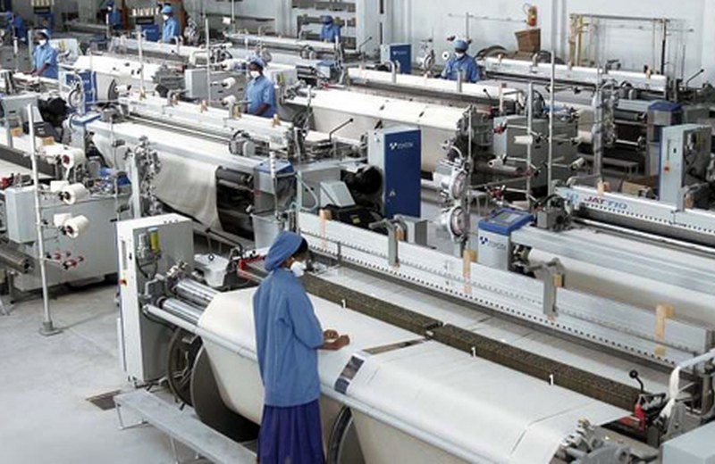 Fabric being inspected on the weaving floor